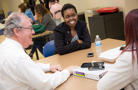 President Faulkner with students.